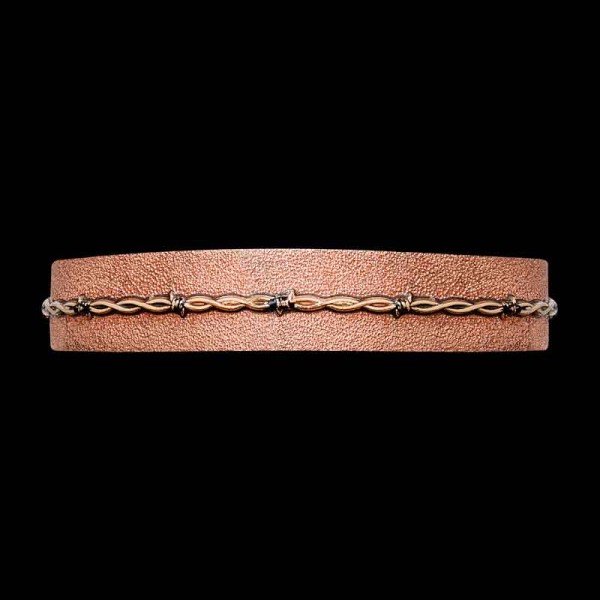 Add a rugged touch to any western outfit with our Johnny Western Cuff Bracelet. Crafted on a Copper base with our signature matted finish and 3D Bronze barbed wire. Order it now! 